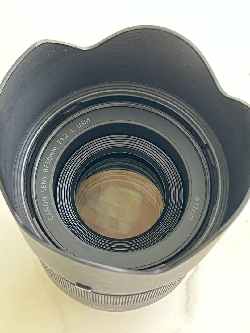 50mm 1.2 RF L (Category: Lens & Kits) located in Quezon City. Submitted by luwisi2 (Listing ID 1322945141, Image 2). Description: With box and pouch Cosmetics is 9.5/10 Kept in dry box RFS: Not really a 50mm user.