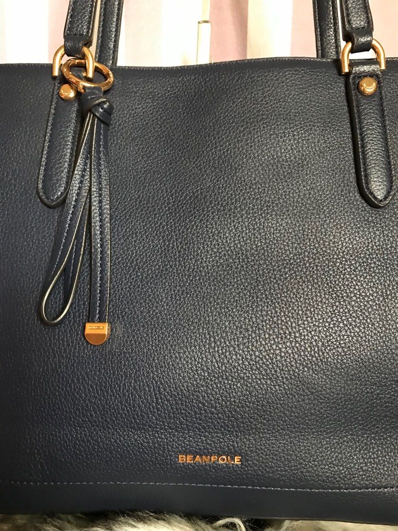 Beanpole Tote Bag (Category: Luxury Bags & Wallets) located in Muntinlupa City. Submitted by rina.rina3 (Listing ID 1322931793, Image 3). Description: Like new dark blue Beanpole tote bag Sourced from Korea Very excellent leather and gold hardwares Rivets and bay charm have Beanpole engravings Bag dimensions all in inches, LXWXH 17in x 6in x 10.5 Bag total height including handles is 21in Slightly negotiable Buyer to shoulder shipping fee .