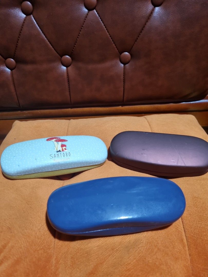 Bundle Eyeglass Cases (Category: Vision Care) located in Paombong. Submitted by sweetdeals0181656 (Listing ID 1323028288, Image 2). Description: Item 1 is Santoro Poppi Lovers with visible scratch on top Item 2 is Specsavers with stain on top Item 3 is Scrivens with flaw as the lower portion of the inside part needs to be reglued..