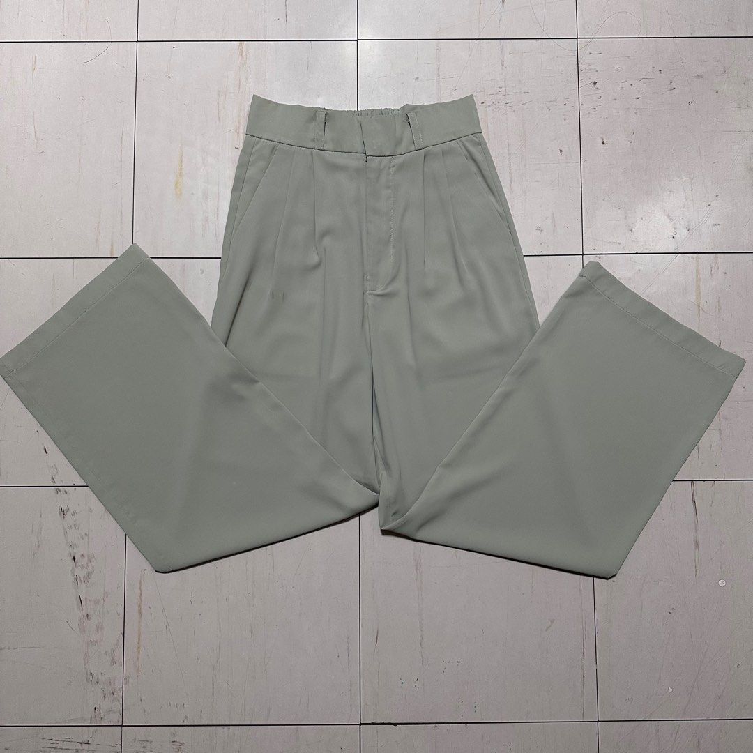 Green High-Waisted Pleated Pants (Category: Other Bottoms) located in Manila. Submitted by catchim (Listing ID 1322979461, Image 2). Description: Preloved pants 💚 GOOD CONDITION. Minor Issues •some marks on the right side, but barely noticeable (see photos for reference) Free Size L: 39.5” W: 12.5” Note: measurements are done laid flat PM for more details!.