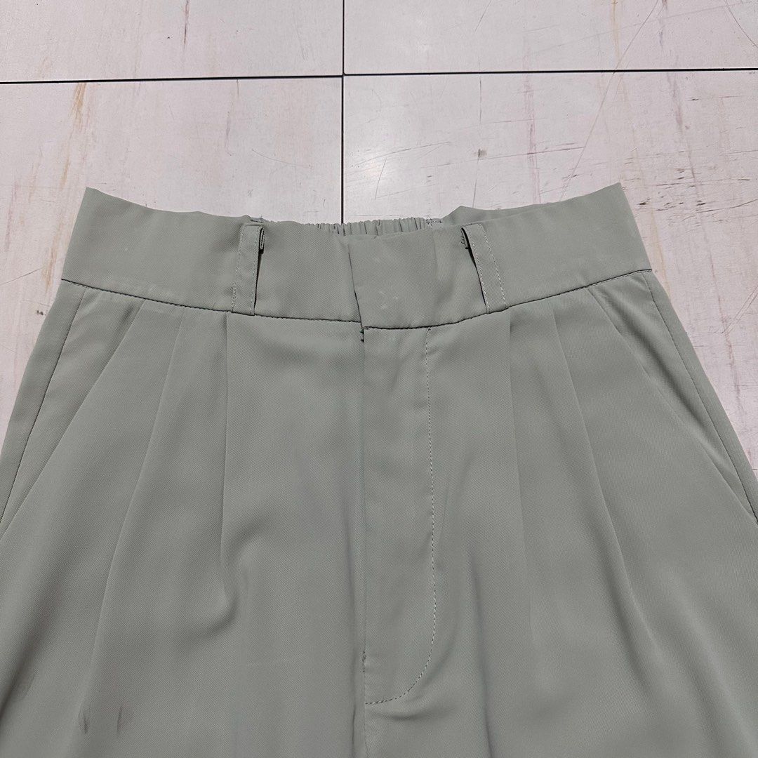 Green High-Waisted Pleated Pants (Category: Other Bottoms) located in Manila. Submitted by catchim (Listing ID 1322979461, Image 1). Description: Preloved pants 💚 GOOD CONDITION. Minor Issues •some marks on the right side, but barely noticeable (see photos for reference) Free Size L: 39.5” W: 12.5” Note: measurements are done laid flat PM for more details!.