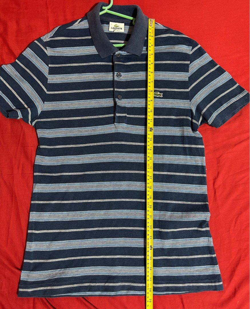 LACOSTE POLO SHIRT (original) (Category: Tshirts & Polo Shirts ) located in San Ildefonso. Submitted by PatchAdamss (Listing ID 1323010297, Image 1). Description: For sale!!! LACOSTE POLO SHIRT (original) Blue stripes No holes No fades Presentable 9/10 condition Only issue may small cut s neck tag.