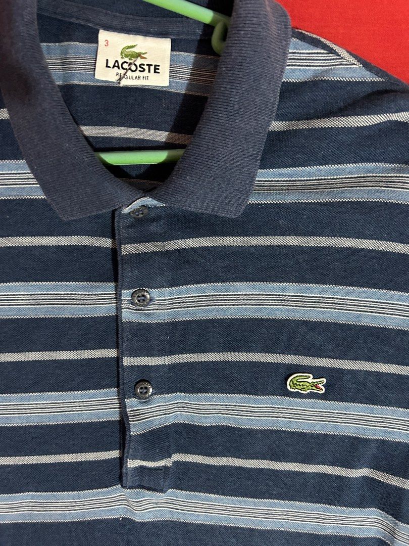 LACOSTE POLO SHIRT (original) (Category: Tshirts & Polo Shirts ) located in San Ildefonso. Submitted by PatchAdamss (Listing ID 1323010297, Image 3). Description: For sale!!! LACOSTE POLO SHIRT (original) Blue stripes No holes No fades Presentable 9/10 condition Only issue may small cut s neck tag.