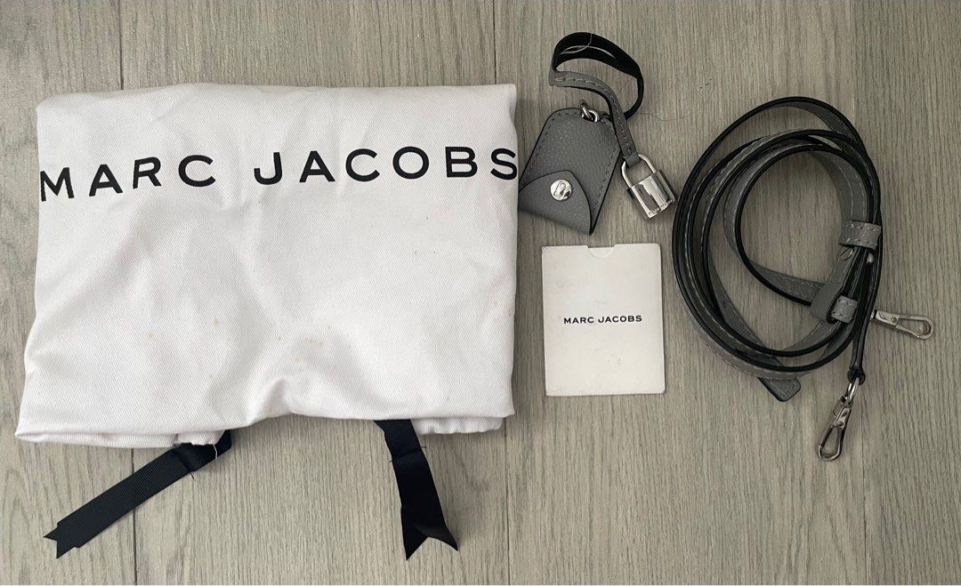Marc Jacobs The Mini Tote (Category: Luxury Bags & Wallets) located in Makati City. Submitted by livelovelux (Listing ID 1322963544, Image 2). Description: RFS: Decluttering Two top handles, silver-toned hardware, interlocking j monogram patch, lock accent detail, logo detail, magnetic closure, zip-around fastening. Composition: Leather Dimensions: H 21 x W 31 x D 10cm. Strap drop: 60-47cm. Interior: Two open compartments, one middle zip compartm