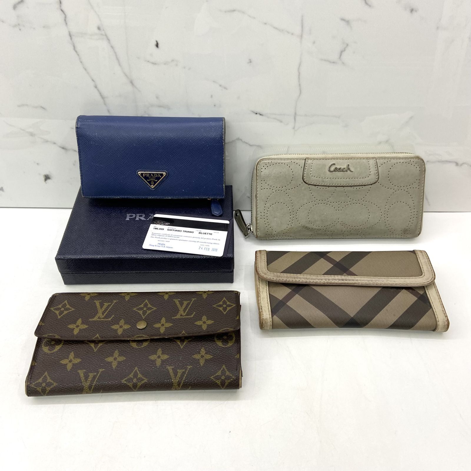 Burberry wallet vs prada outlet