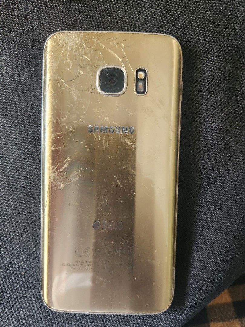 Samsung S7 (For Parts or to fix) (Category: Samsung) located in Manila. Submitted by kieeeeennnnny (Listing ID 1322926021, Image 2). Description: Didn't know what happened, just deadboot. Probably battery defect or software defect. Price can be negotiated. The backplate is damaged by the previous repairer..