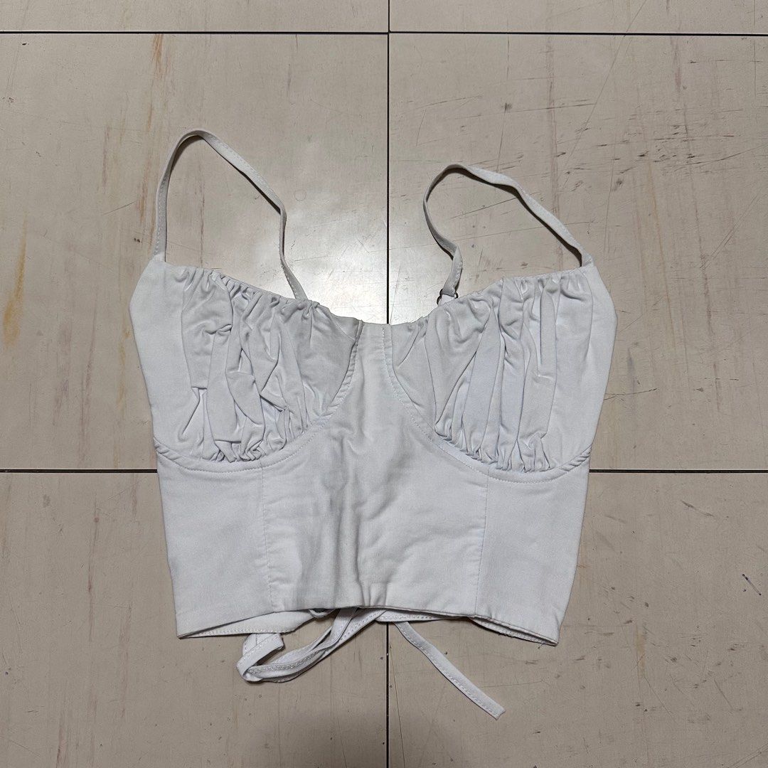 White Backless Bustier Croptop (Category: Sleeveless) located in Manila. Submitted by catchim (Listing ID 1322977238, Image 2). Description: Preloved top 🤍 NO ISSUES. Good condition Free Size L: 9” W: 11” Note: measurements are done laid flat PM for more details!.