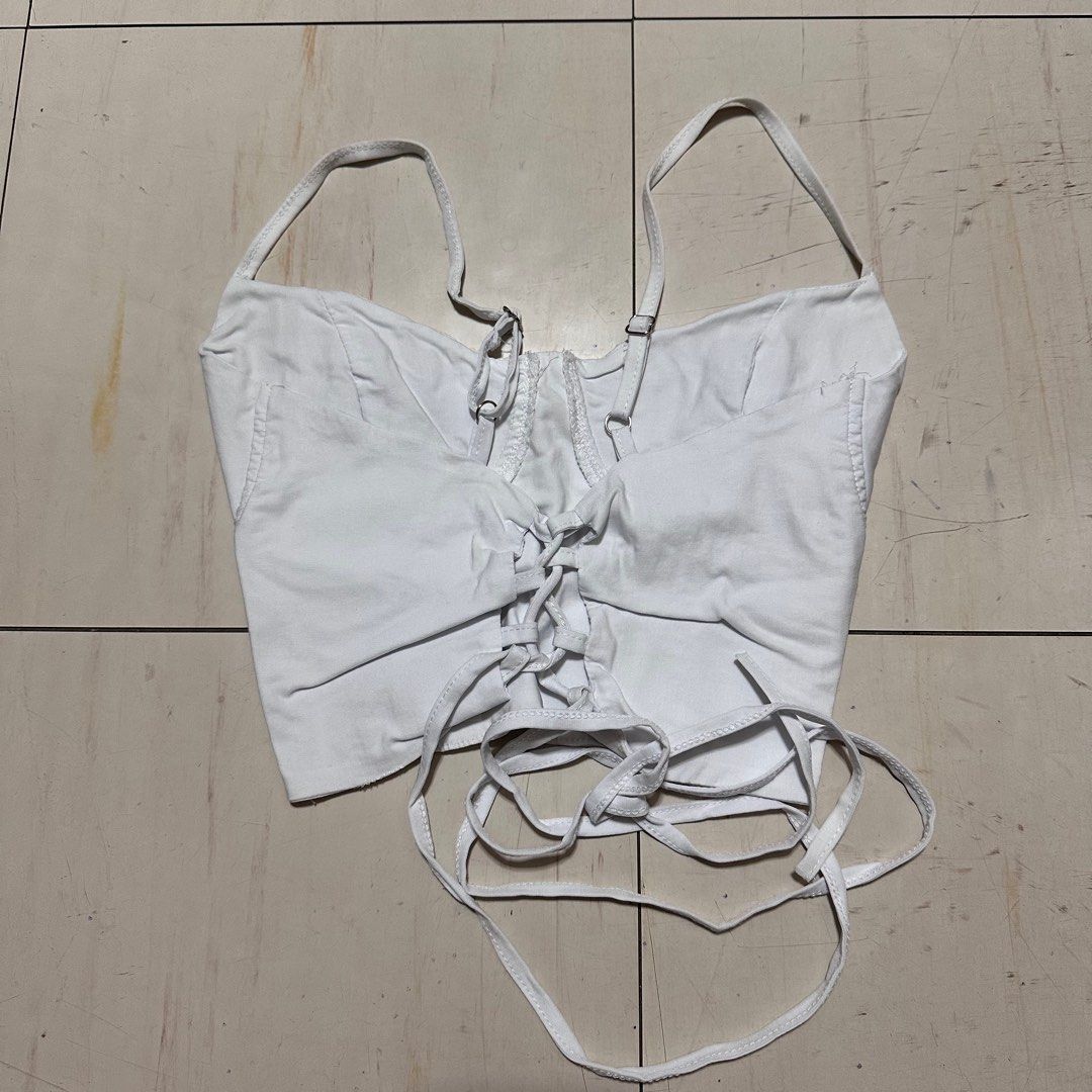White Backless Bustier Croptop (Category: Sleeveless) located in Manila. Submitted by catchim (Listing ID 1322977238, Image 3). Description: Preloved top 🤍 NO ISSUES. Good condition Free Size L: 9” W: 11” Note: measurements are done laid flat PM for more details!.