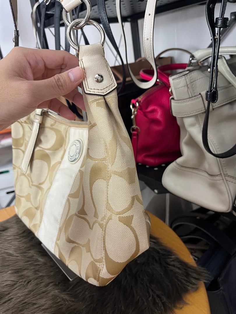 Coach Signature Hobo Bag (White) (Category: Luxury Bags & Wallets) located in Quezon City. Submitted by eclipse.leandro (Listing ID 1318096052, Image 2). Description: Signature Hobo Bag (White) Condition: 7/10 31cm x 21cm 2,500 PHP Issues: Wear and tear on handle and piping. But other parts still in beautiful condition All products are 100% Authentic bought from Japan. Disclaimer: We are not affiliated with the brands listed. #LuvLuxe #LuxuryJPNF