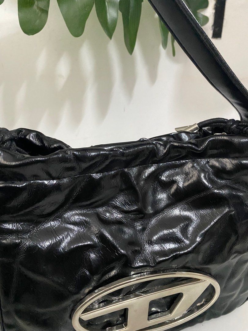 Diesel Shoulder Bag (Category: Luxury Bags & Wallets) located in Santa Rosa. Submitted by sassycollection. (Listing ID 1318180878, Image 3). Description: Good condition Silver hardwares Shoulder Bag Unisex Rare edition of Diesel release.