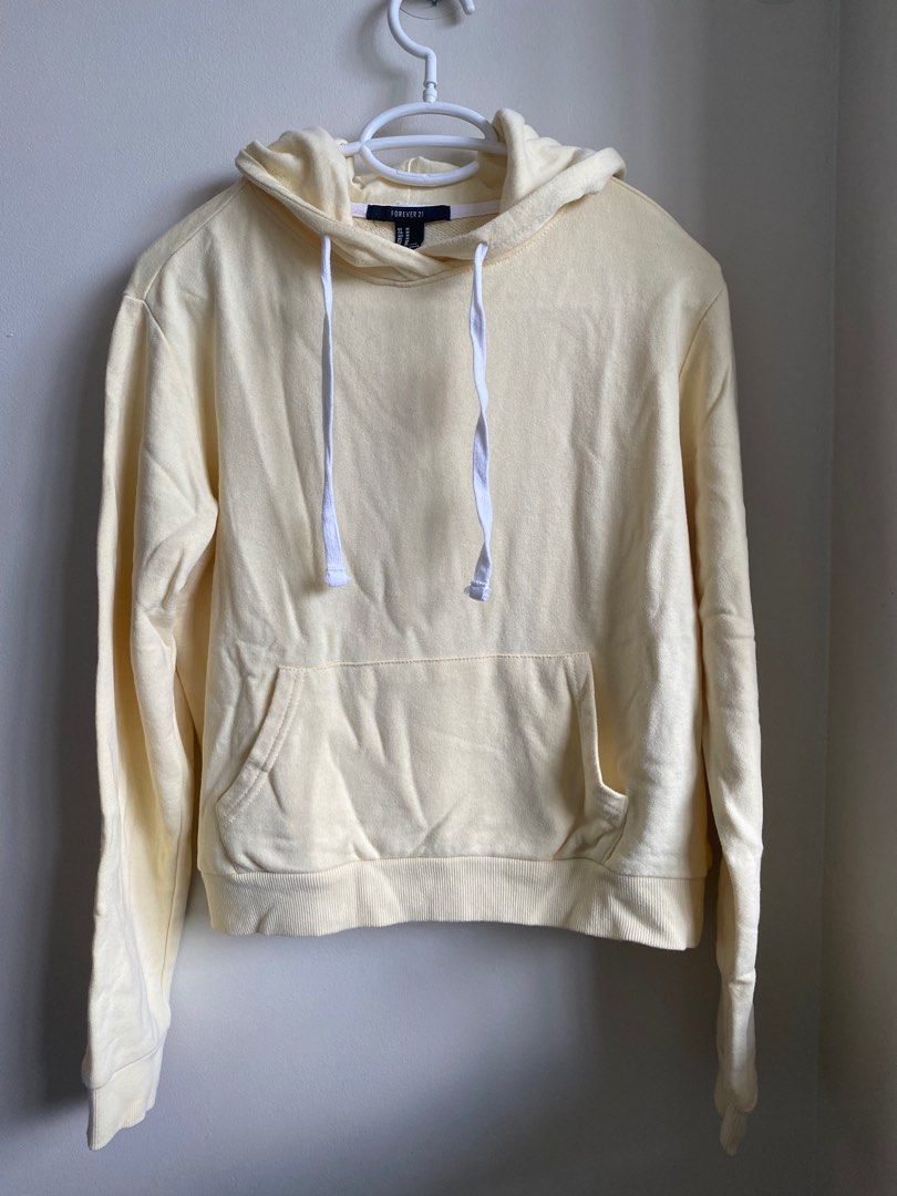 Forever 21 yellow hoodie (Category: Coats, Jackets and Outerwear) located in Pasig City. Submitted by ulit.ulitph (Listing ID 1318121922, Image 1). Description: Forever 21 Pastel yellow hoodie Thick fabric.