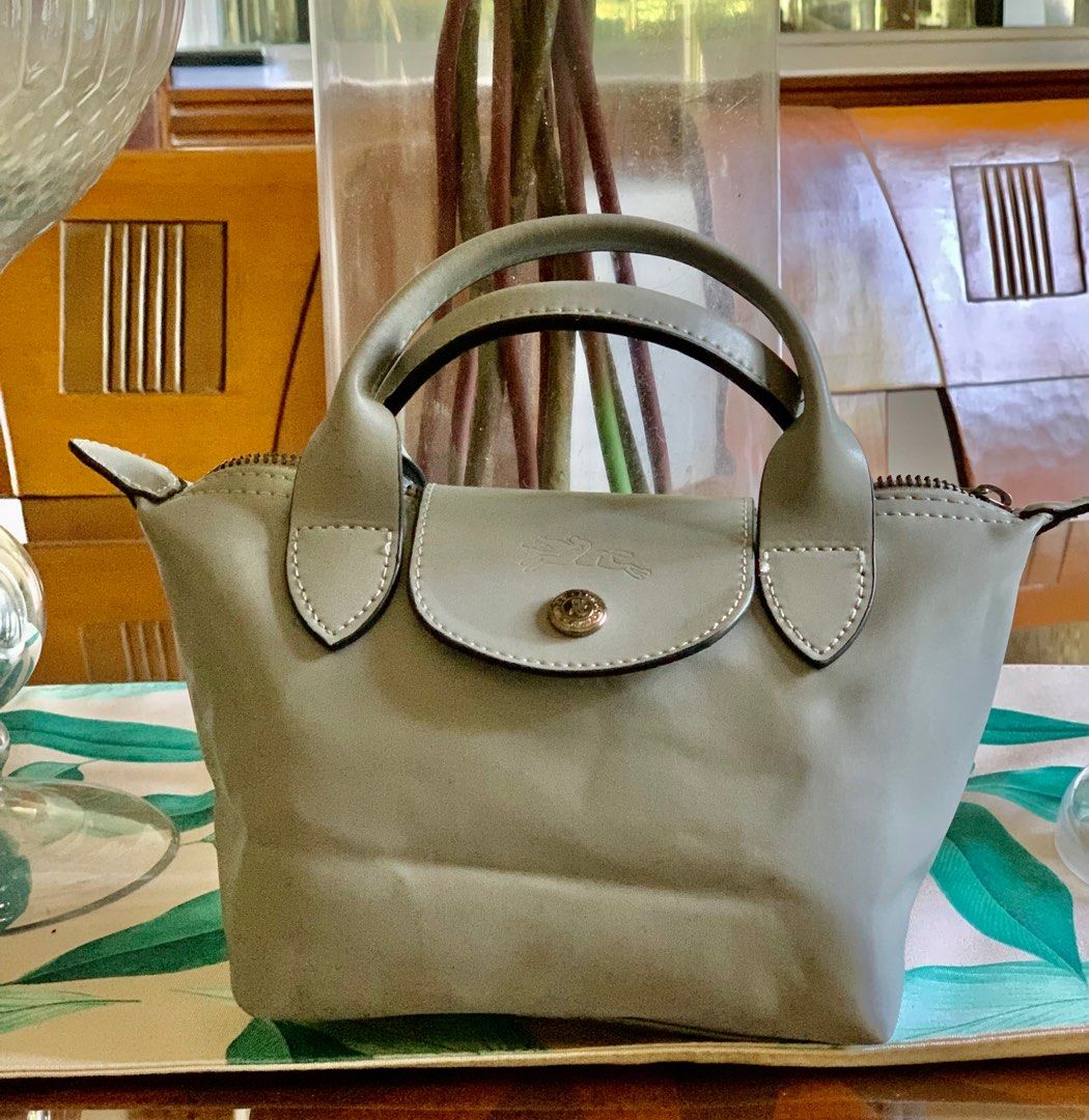 Longchamp Micro Bag / Authentic (Category: Luxury Bags & Wallets) located in Guagua. Submitted by rizza4 (Listing ID 1318091288, Image 1). Description: • Lambskin genuine leather • rubber lining intact • no sign of usage • no sling • minor issue na fold lang sa box • silver hardware.