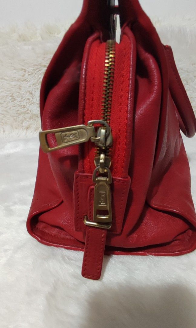 YSL Cabas ChYc👛👜 (Category: Luxury Bags & Wallets) located in Cavite. Submitted by yerbua103 (Listing ID 1318167065, Image 3). Description: 👉This signature Saint Laurent Cabas chyc is an everyday city bag. It features an antique gold-toned Y embellished strap and crafted from a soft leather of red color. It is perfectly roomy for holding your daily essentials. The bag itself is in good condition. The hardware has light surface scratches and no