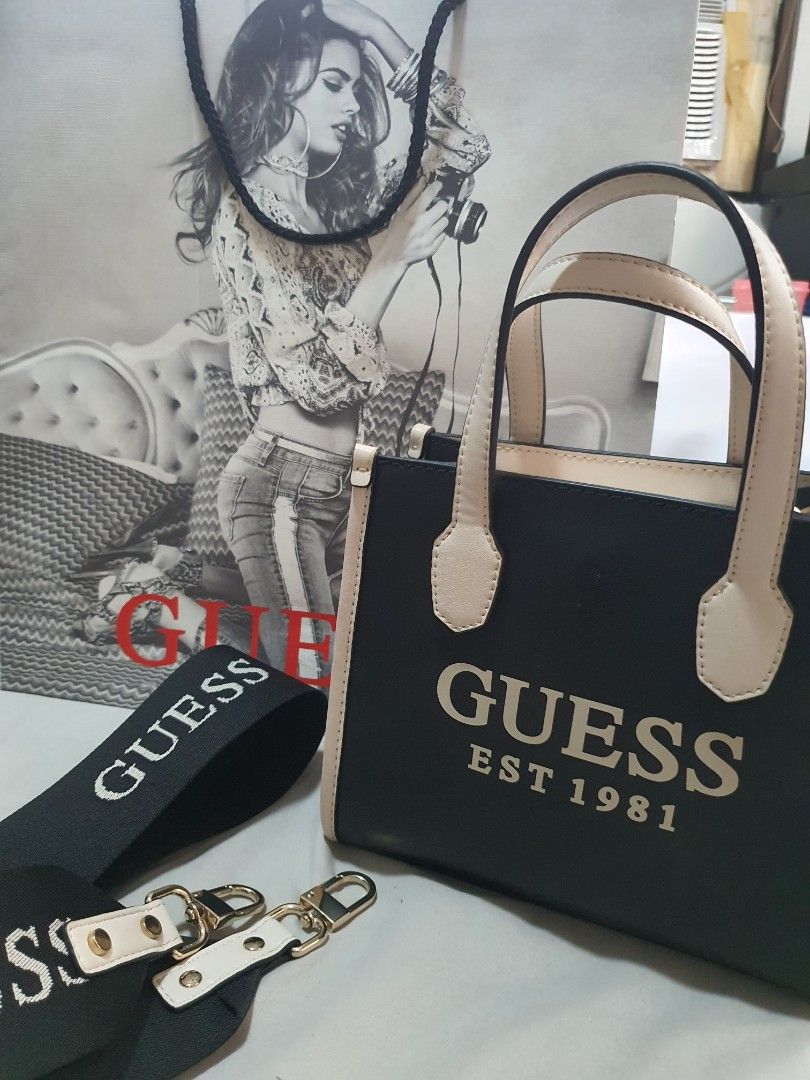 Guess Mini Tote Bag (Category: Luxury Bags & Wallets) located in Paranaque City. Submitted by monsalvemarielle08 (Listing ID 1318266823, Image 1). Description: Original Guess Mini Tote Bag only used twice. RFS: too small for my preferrence and decluttering 😊 minor issue: see last pic PM me if you want more pics of the bag and still negotiable.