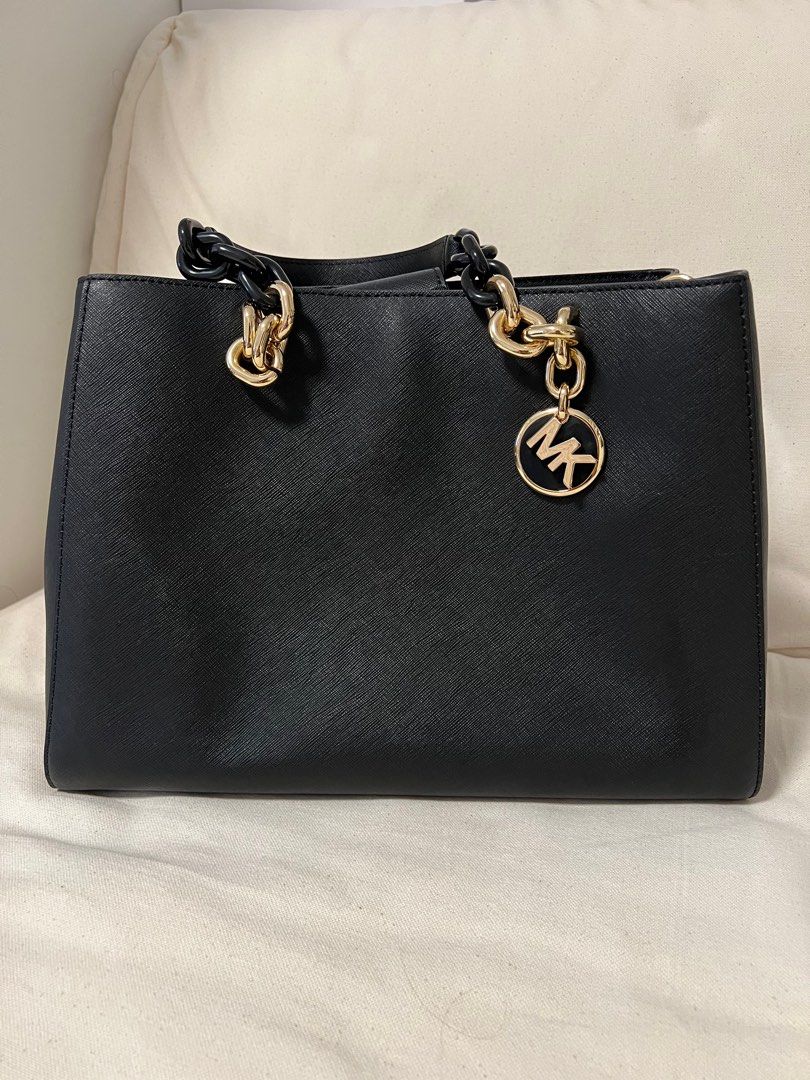 Mk black and gold bag best sale