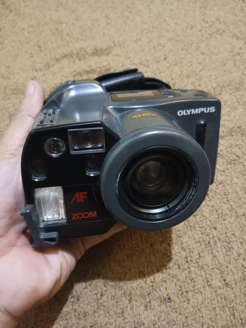 Olympus AZ-300 superzoom - untested (Category: Cameras) located in Quezon City. Submitted by markgolveo (Listing ID 1318302795, Image 1). Description: Olympus AZ-300 superzoom - untested for parts out repairs or collection display good tolerable cosmetic signs of wears good clean film compartment issue - stuck battery compartment broken strap lock plastic in front side of camera see image for reference.