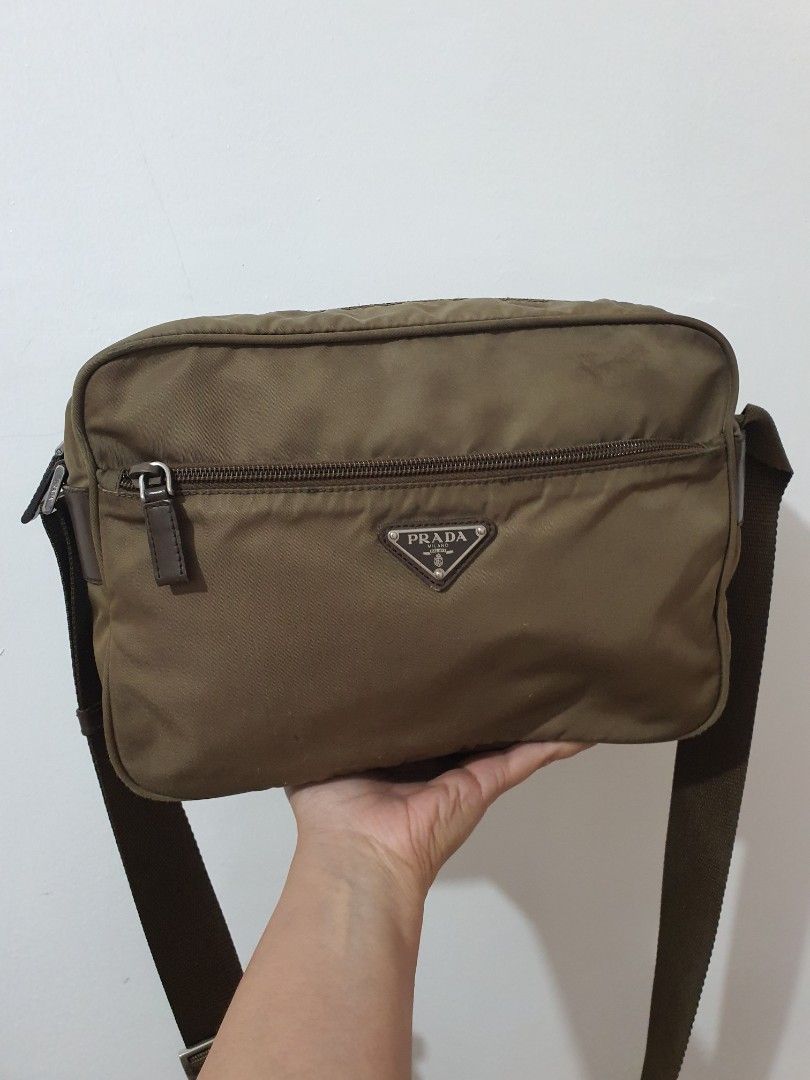 Prada Tessuto Nylon Crossbody (Category: Luxury Bags & Wallets) located in Davao. Submitted by moodsale (Listing ID 1318573282, Image 1). Description: Prada Tessuto Nylon Crossbody Authentic Unisex bag with prada dust bag This crossbody bag features a nylon body, an adjustable flat shoulder strap, a top zip closure, an exterior front zip pocket, and an interior zip pocket. Pls see pictures.
