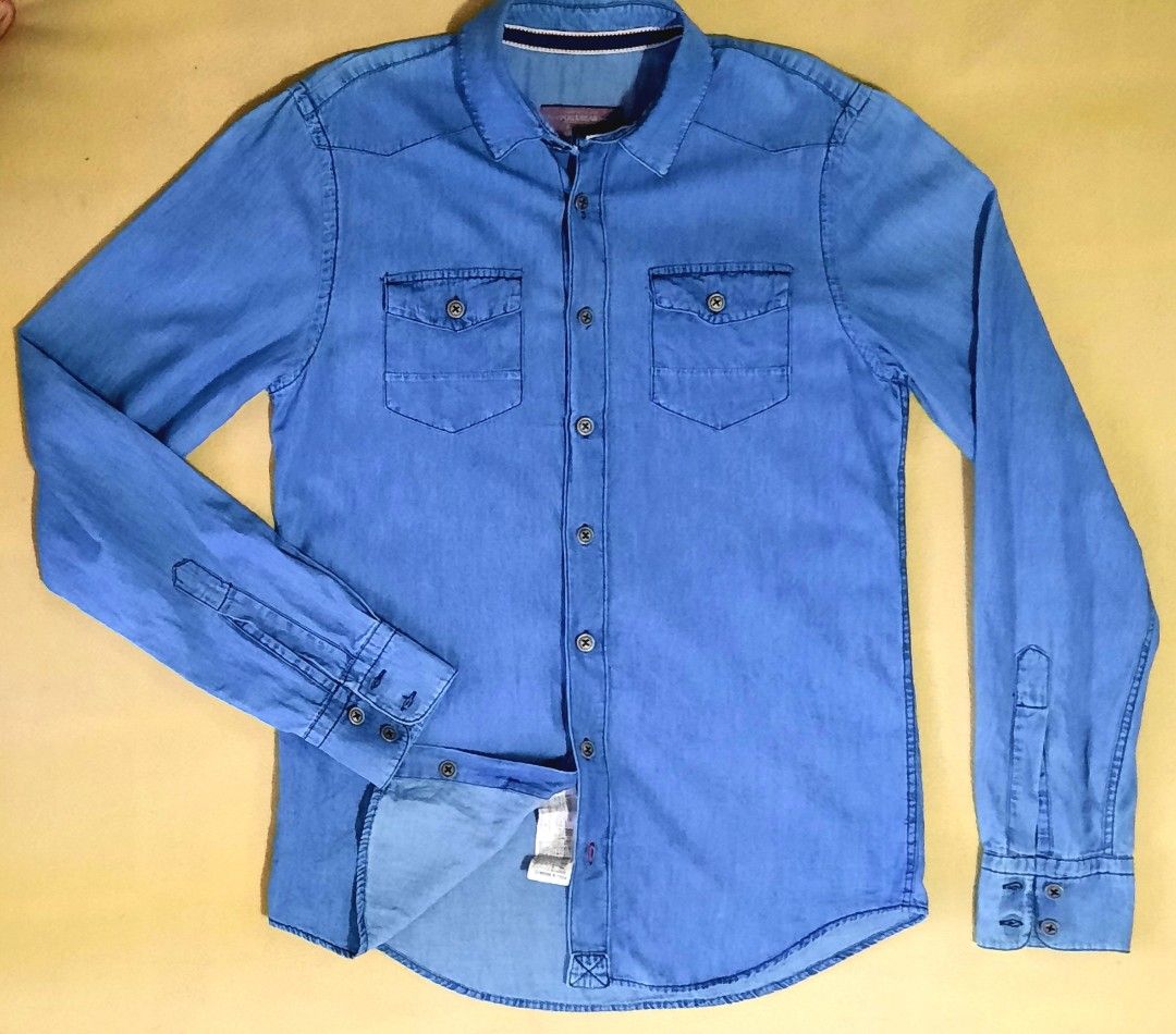 PULL & BEAR - MEN'S DENIM LONGSLEEVES SHIRT - SMALL (Category: Tshirts & Polo Shirts ) located in Lapu Lapu. Submitted by ralphralf (Listing ID 1318540206, Image 2). Description: Brand : PULL & BEAR men's denim shirt L/S - long sleeves Color: light washed - blue Size: small Dimes: 19 x 26 (see photos) Fabric: 100% cotton Very soft/high quality fabric, easy iron Ready to wear, washed and ironed already No ISSUES no yellowing and no stains Colors m