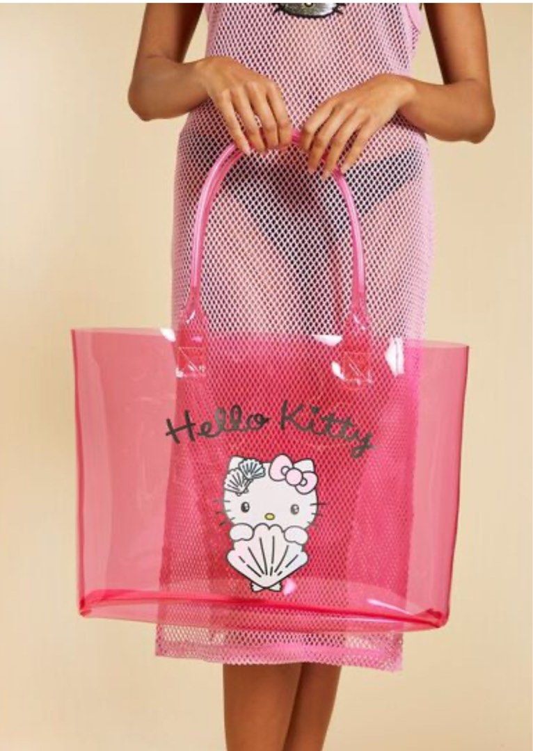Seashell Hello Kitty Jelly Tote Bag (Category: Shoulder Bags) located in Manila. Submitted by avenue.de.belle (Listing ID 1318613385, Image 1). Description: Hello Kitty and Friends x Forever 21 collection BRAND NEW ONHAND This jelly tote bag features “Hello Kitty” text, front Hello Kitty and seashell graphics, a transparent construction, and top handles. - © 2024 SANRIO CO., LTD. Used Under License Content + Care - 100% polyurethane - Hand wash c