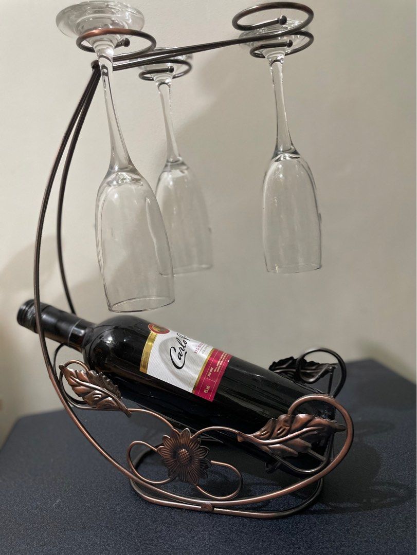 Wine Rack Stemware Holder | Kitchen Organizer, Elegant Metal Countertop Decor (Category: Wine Cellar & Storage) located in Paranaque City. Submitted by homefashionbymaple (Listing ID 1318592327, Image 1). Description: Description: 🔹 1 x wine rack ( not including bottle and wine glass),10.5 x 6.3 x 14.2 inches 🔹 holds 1 full bottle and up to 4 glasses 🔹 Bronze colored Countertop storage rack, sturdy and durable, not easy to deformation. ♦️No is