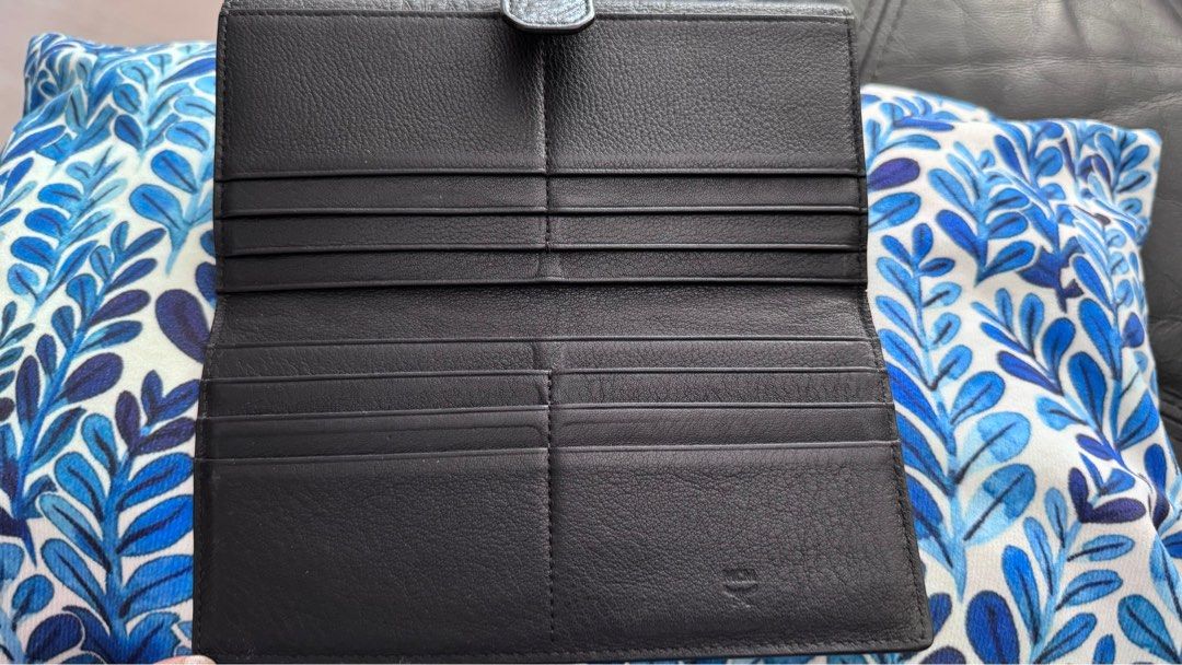 100% Authentic MCM long leather wallet (Category: Bags & Wallets) located in Singapore. Submitted by relaxenjoyhappy (Listing ID 1318630621, Image 3). Description: 100% Authentic MCM long leather wallet Still in Good Condition Comes with :- 👍🏻Authentic MCM long wallet 👍🏻Authentic Card & care card 👍🏻Original dustbag 👍🏻Original wallet Box ☺️No paper bag ☺️No receipt Interested buyer, pls chat here. thanks .