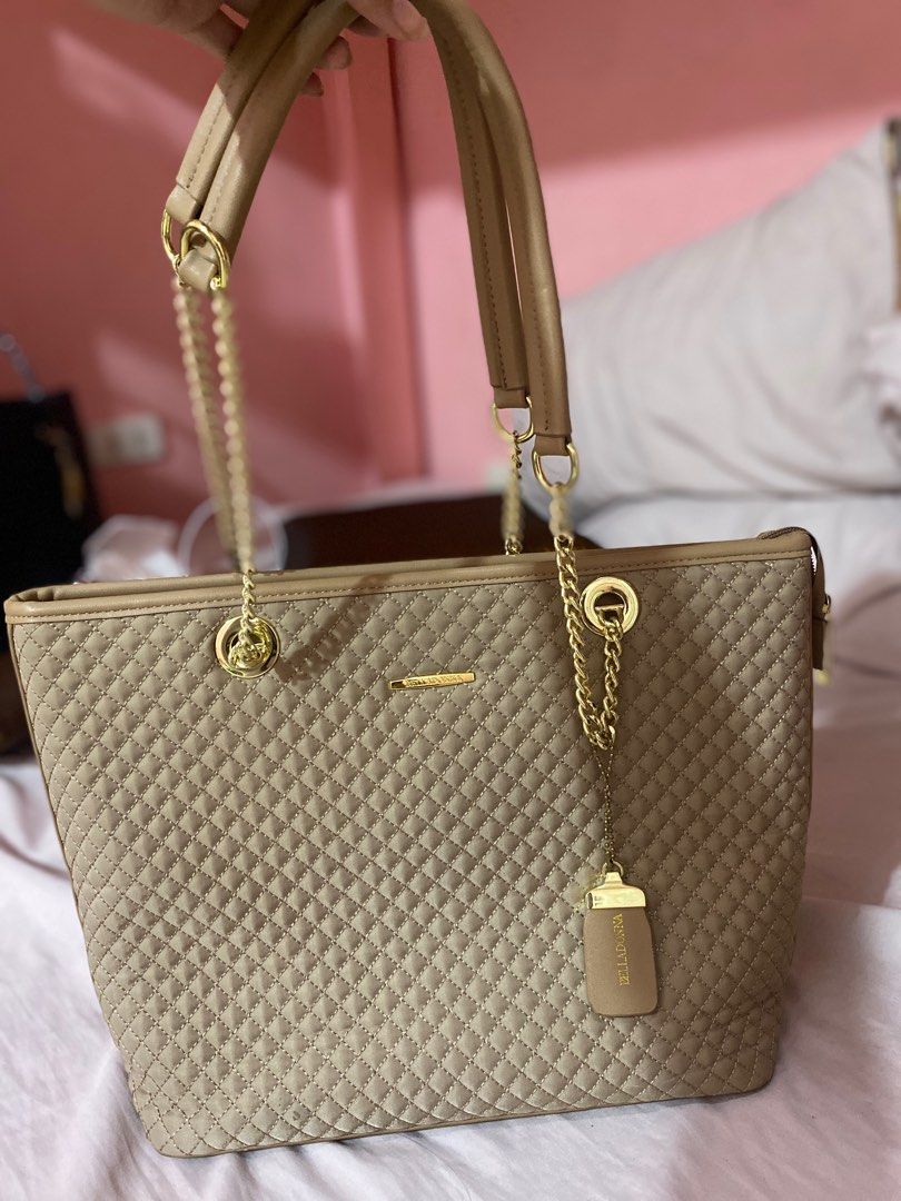BELLADONA TOTE BAG/ SLING BAG (Category: Tote Bags) located in Taytay. Submitted by lbrndmn (Listing ID 1318733645, Image 1). Description: FOR SALE ‼️ lightly used 2 way Belladona bag/ tote bag color: Nude Beige selling price: dating 2000, ngayon 1000 na lang (slightly negotiable for sure buyer) -with dust bag -with long strap (can be a tote bag or sling/crossbody bag) -All chains are in good condition (sobrang makinang pa 😩) -Kasiya A4 Folder (