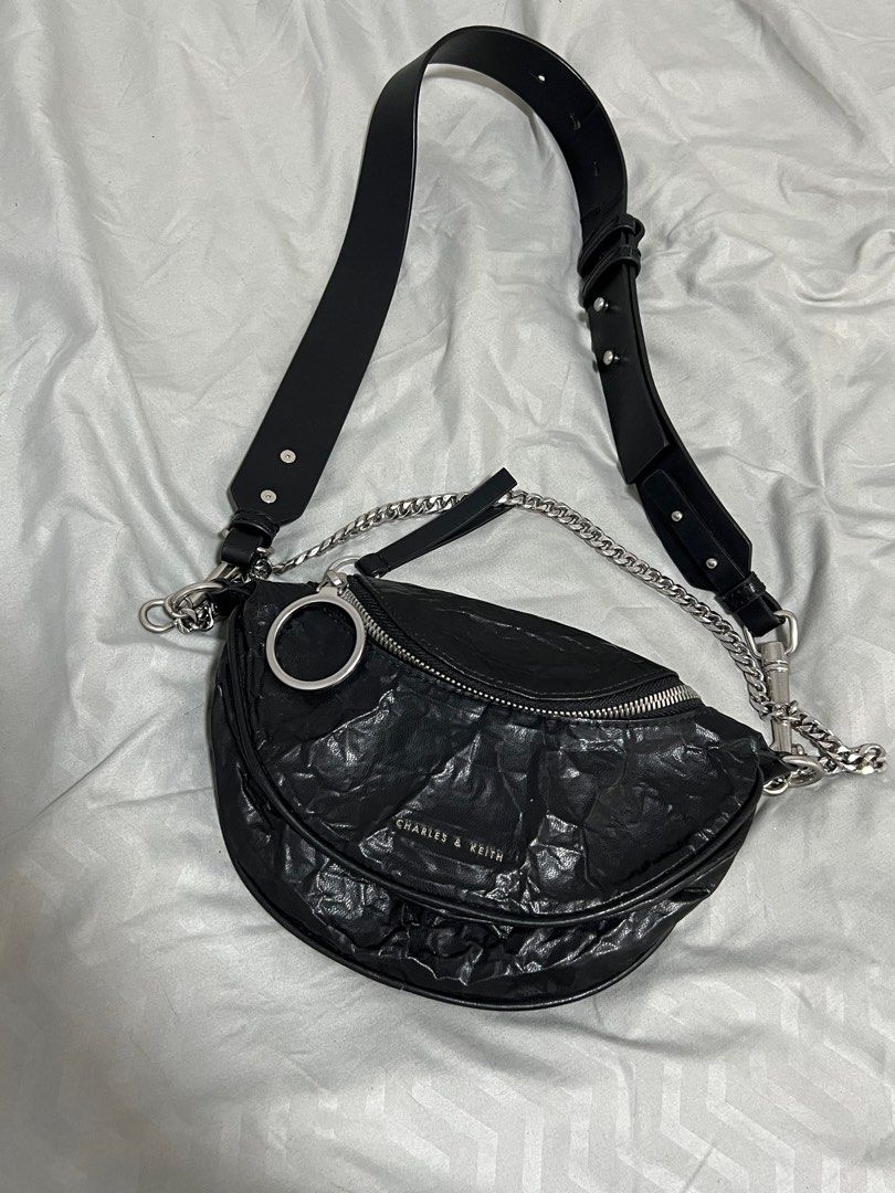 Charles & Keith Halfmoon Black Crinkled Leather Bag (Category: Cross-body Bags) located in Quezon City. Submitted by leighdeclutters (Listing ID 1318790897, Image 1). Description: ✨Used once ✨Refer to 3rd pic for the flaw ✨Otherwise, it looks brand new ✨RFS: Style is too young for me 😅.