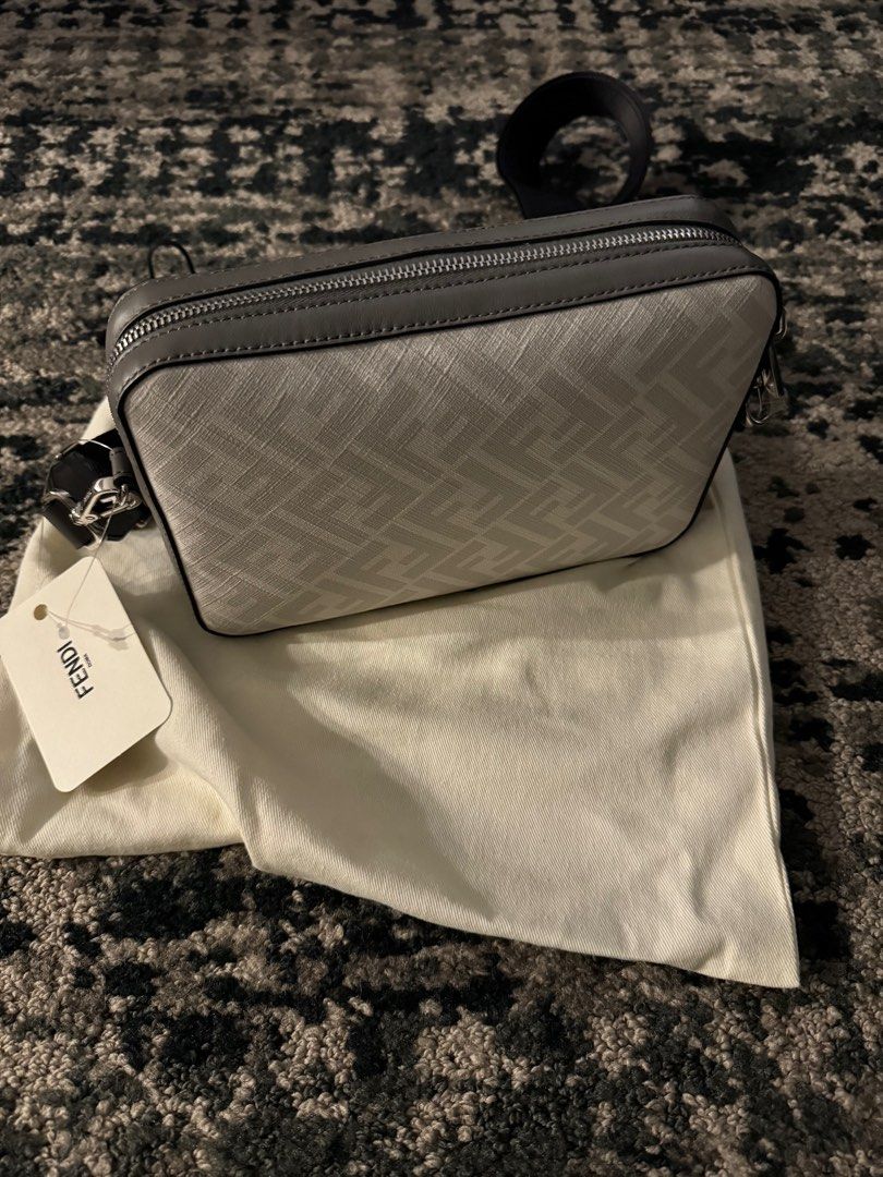 Fendi Diagonal Camera Bag (Category: Luxury Bags & Wallets) located in Pasig City. Submitted by starluxeph (Listing ID 1318650767, Image 2). Description: Fendi Diagonal Camera Case Multicolor leather bag Compact shoulder bag made of beige leather and fabric with FF motif. Embellished with dark brown leather diagonal insert. Zipper fastening and lined interior, palladium-finish metalware. The cross-body strap is adjustable and detachable. Made in 