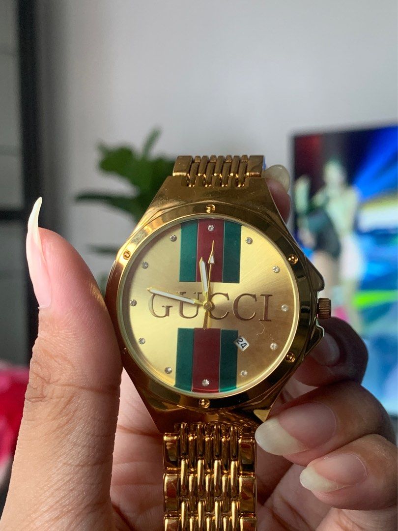 Gucci gold plated watch top