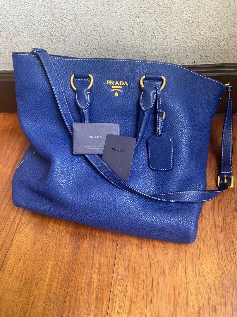 PRADA hand sling bag blue leather (Category: Luxury Bags & Wallets) located in Makati City. Submitted by scarwee (Listing ID 1318769184, Image 3). Description: With signs of wear on the edges of the bag as seen on pics.
