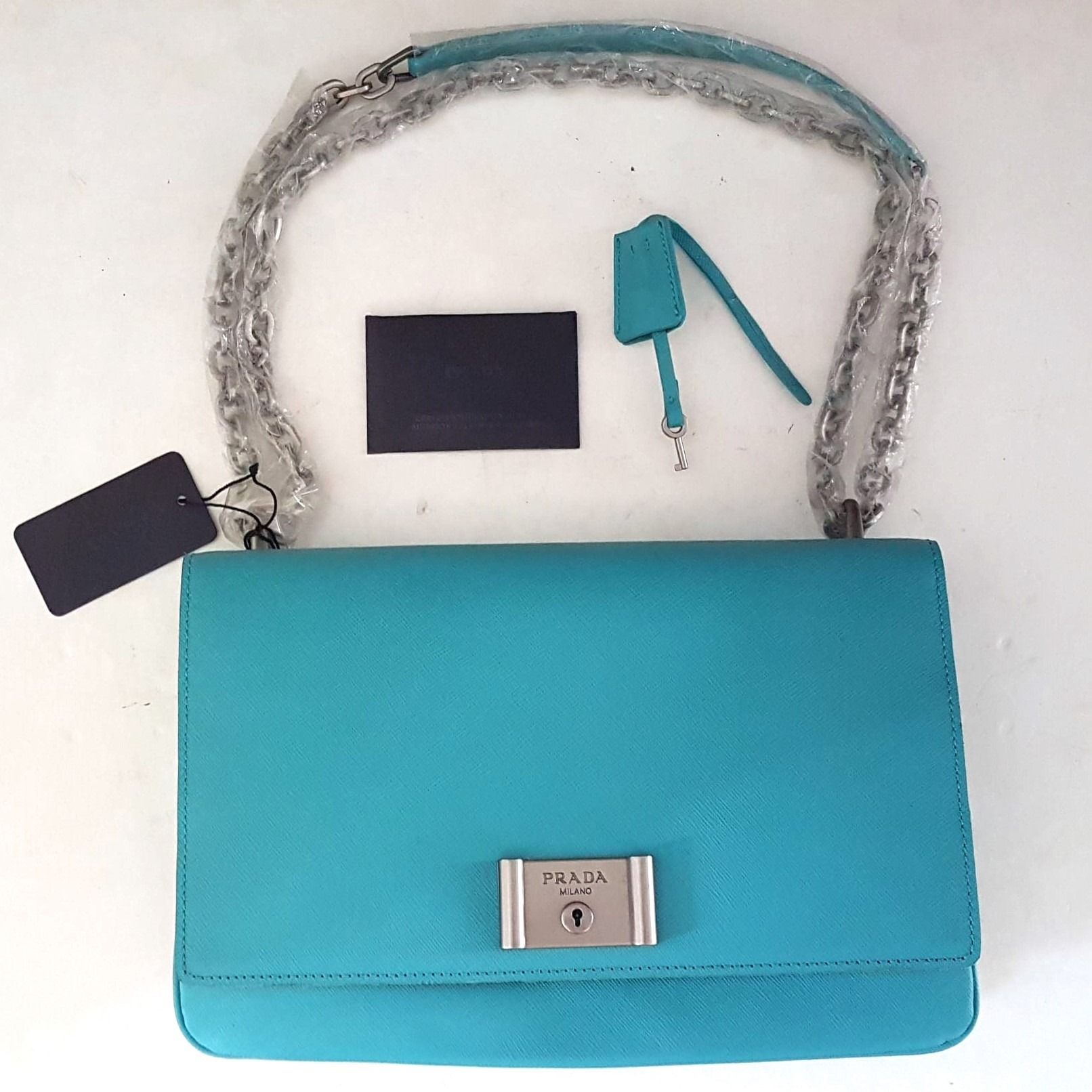 Prada Metal Closure Shoulder Bag made in ITALY Prada Accordion Lock Key Model Chain Strap Leather Cross body handbag Tote Vintage Look
