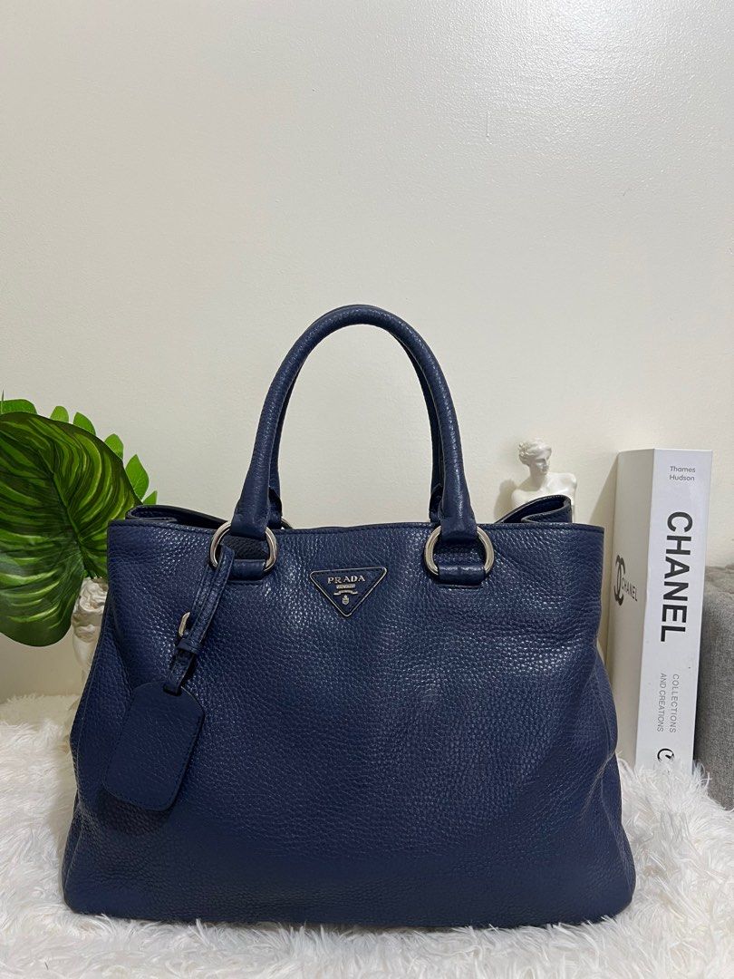 Prada Blue Vitello Diano Leather Tote bag (Category: Luxury Bags & Wallets) located in Pasig City. Submitted by r.m.c2 (Listing ID 1318935707, Image 3). Description: Prada Blue Vitello Diano Leather Tote 100% Authentic With Dust bag RFS: Decluttering MOP: GCash or BPI.