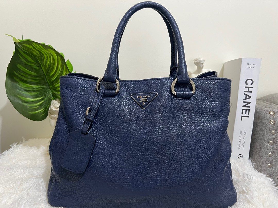 Prada Blue Vitello Diano Leather Tote bag (Category: Luxury Bags & Wallets) located in Pasig City. Submitted by r.m.c2 (Listing ID 1318935707, Image 1). Description: Prada Blue Vitello Diano Leather Tote 100% Authentic With Dust bag RFS: Decluttering MOP: GCash or BPI.