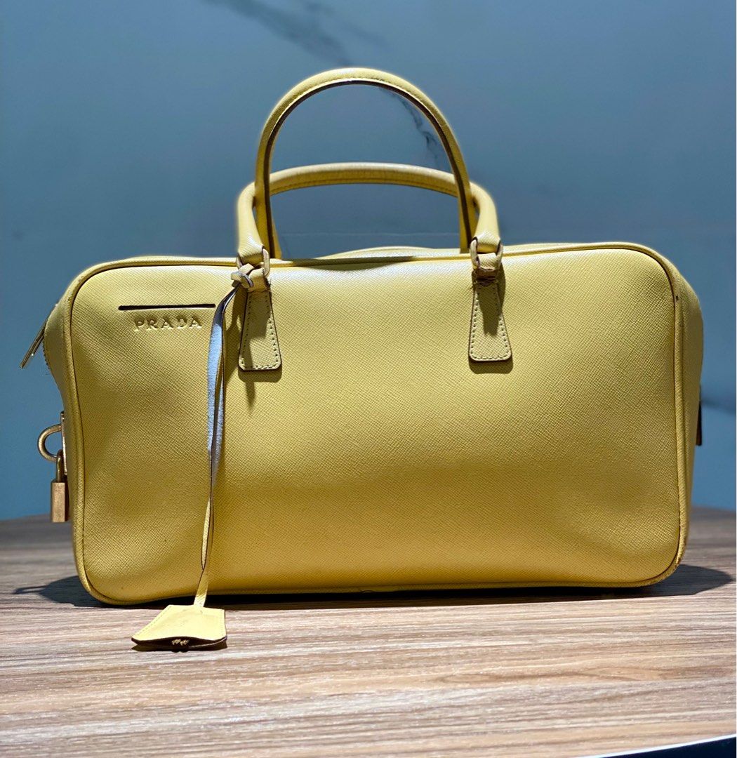 Prada Saffiano Leather Top Handle (Category: Luxury Bags & Wallets) located in Quezon City. Submitted by acepangili29109 (Listing ID 1318823973, Image 1). Description: ♦️Prada Saffiano Leather Handbag ♦️Rank: 8/10 Minimal Flaws otherwise in good condition. ♦️Inclusion: Card care and Lock set ⚠️Price of the item is slightly Negotiable for sure buyers only. ♦️Mode of Payment: Cash ; G cash; Credit Card or Bank Transfer..