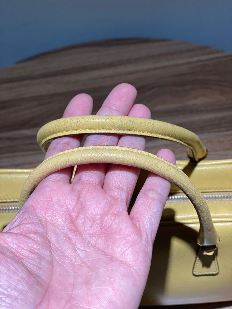 Prada Saffiano Leather Top Handle (Category: Luxury Bags & Wallets) located in Quezon City. Submitted by acepangili29109 (Listing ID 1318823973, Image 2). Description: ♦️Prada Saffiano Leather Handbag ♦️Rank: 8/10 Minimal Flaws otherwise in good condition. ♦️Inclusion: Card care and Lock set ⚠️Price of the item is slightly Negotiable for sure buyers only. ♦️Mode of Payment: Cash ; G cash; Credit Card or Bank Transfer..