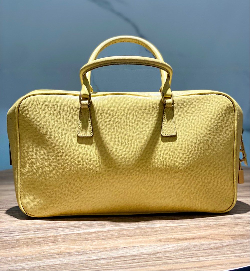 Prada Saffiano Leather Top Handle (Category: Luxury Bags & Wallets) located in Quezon City. Submitted by acepangili29109 (Listing ID 1318823973, Image 3). Description: ♦️Prada Saffiano Leather Handbag ♦️Rank: 8/10 Minimal Flaws otherwise in good condition. ♦️Inclusion: Card care and Lock set ⚠️Price of the item is slightly Negotiable for sure buyers only. ♦️Mode of Payment: Cash ; G cash; Credit Card or Bank Transfer..