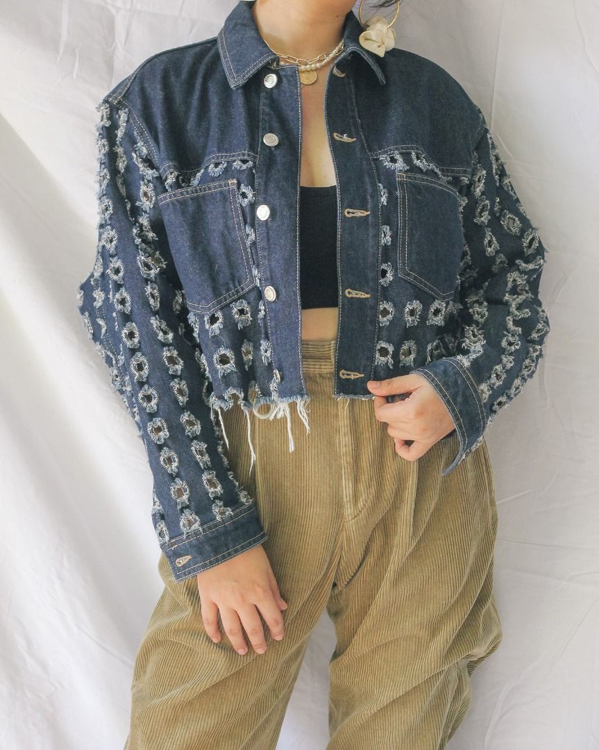 Topshop Cropped Distressed Denim Jacket (Category: Coats, Jackets and Outerwear) located in Manila. Submitted by teeforel (Listing ID 1318937920, Image 1). Description: Topshop Cropped Denim Jacket. Distressed bottom edges and square cut-outs. Still in very good condition. Size: 34/6/2 on tag (S-M) Shoulder = 17.5 inches Bust(Armpit to Armpit) = 21 inches Waist = 21 inches Length = 18 inches Model size is S-M. Height: 5’3’ *Color may vary from ac