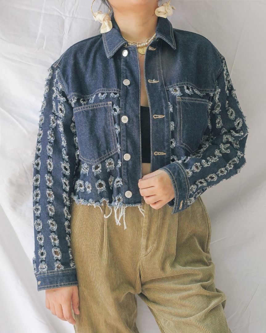 Topshop Cropped Distressed Denim Jacket (Category: Coats, Jackets and Outerwear) located in Manila. Submitted by teeforel (Listing ID 1318937920, Image 2). Description: Topshop Cropped Denim Jacket. Distressed bottom edges and square cut-outs. Still in very good condition. Size: 34/6/2 on tag (S-M) Shoulder = 17.5 inches Bust(Armpit to Armpit) = 21 inches Waist = 21 inches Length = 18 inches Model size is S-M. Height: 5’3’ *Color may vary from ac