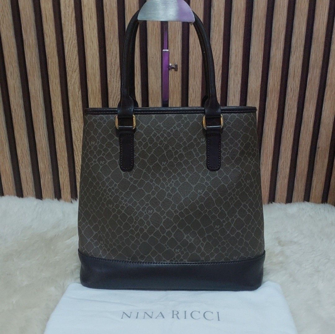 Authentic Nina Ricci Small hand bag (Category: Luxury Bags & Wallets) located in Binangonan. Submitted by makoleksyon (Listing ID 1319043168, Image 3). Description: excellent condition like new no flaws with dust bag included ang cute ng size dami nalalagay kasya small payong at long wallet 💯% Authentic Money back guarantee.