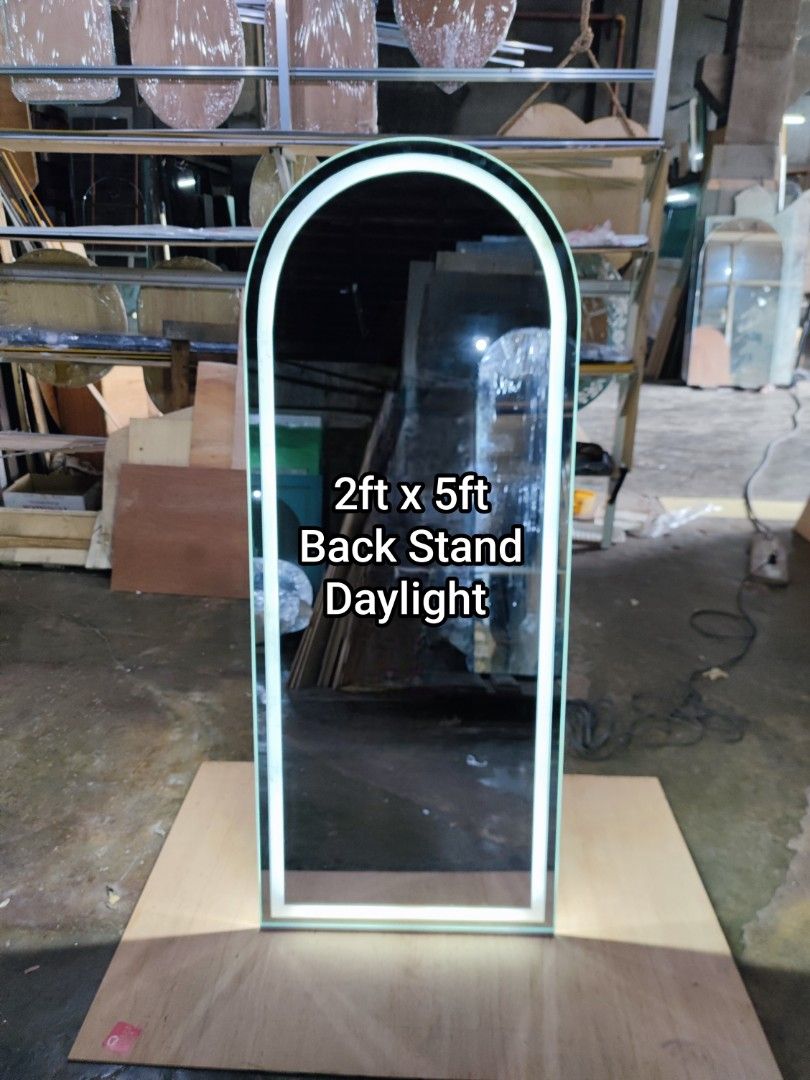 Vanity Mirror Free Standing (Category: Mirrors) located in Malabon City. Submitted by mirrors.ph (Listing ID 1319059771, Image 1). Description: Frameless arc vanity mirror with smoke provision, led lights, and back stand using 6mm thick copper free mirror polished edges. Size: 2ft x 5ft P8300 Customize sizes and shapes are welcome..
