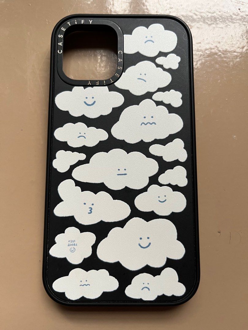 Casetify Cute Clouds Impact Case for iPhone 12 (Category: Cases & Sleeves) located in Quezon City. Submitted by kamilahdeclutters (Listing ID 1323163311, Image 3). Description: Casetify Cute Clouds Impact Case in Matte Black for iPhone 12 RFS: Not my style na 🥲 Super cute case Bought last November 2023 used for less than 6 months then stored .
