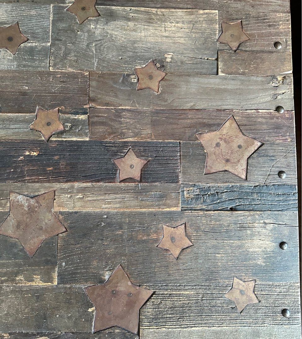 Coffee table (Category: Tables & Sets) located in Singapore. Submitted by phil83 (Listing ID 1323095261, Image 3). Description: This is a reclaimed solid oak top made from several reclaimed floor boards. It has iron rivets pinning the wood to a pitted steel frame. The top has been treated to reflect a distressed wood style. It has several metal stars set in to the top as a detail feature. The stars are iron so designed to tarnish as part of the i