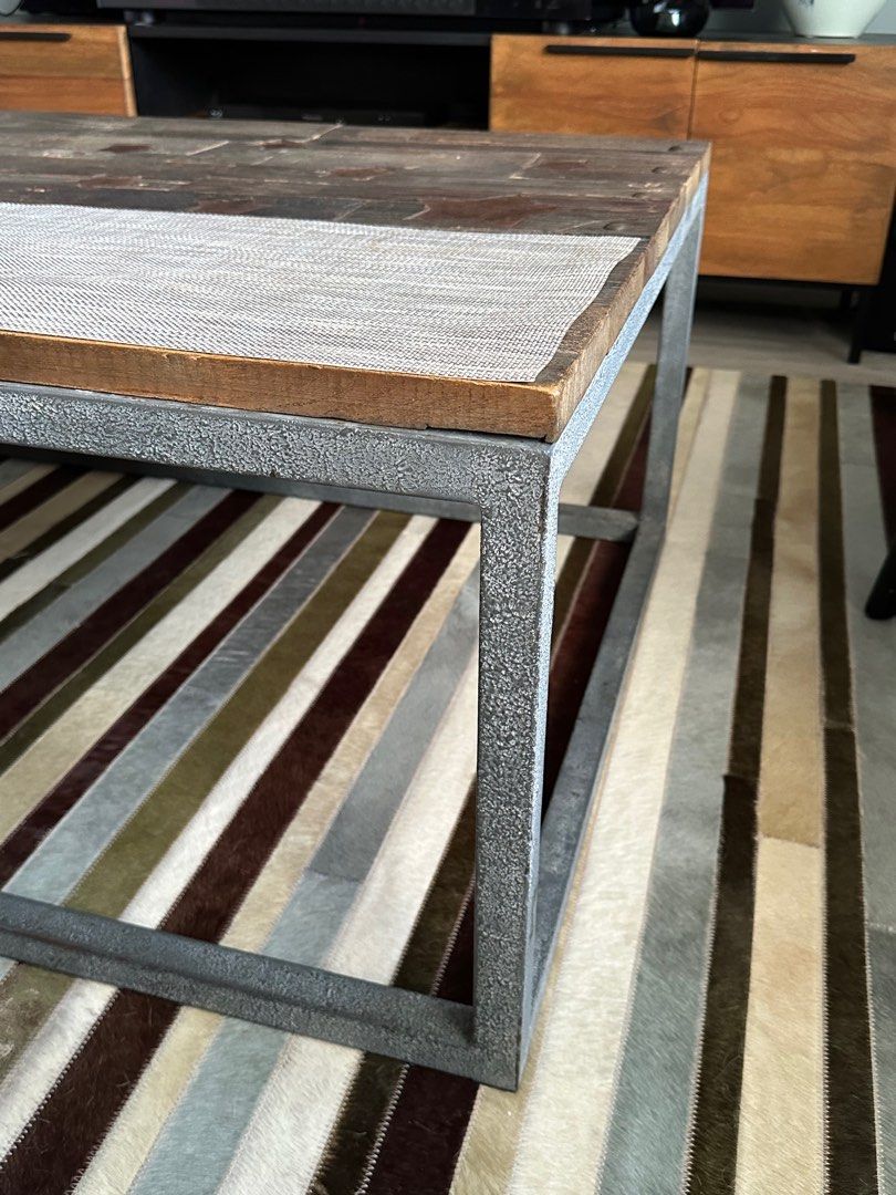 Coffee table (Category: Tables & Sets) located in Singapore. Submitted by phil83 (Listing ID 1323095261, Image 2). Description: This is a reclaimed solid oak top made from several reclaimed floor boards. It has iron rivets pinning the wood to a pitted steel frame. The top has been treated to reflect a distressed wood style. It has several metal stars set in to the top as a detail feature. The stars are iron so designed to tarnish as part of the i