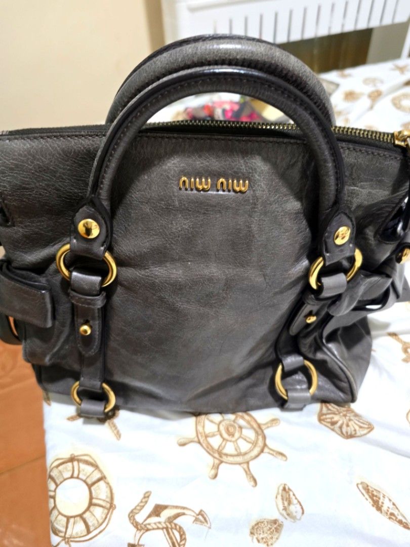 Miu Miu Hand Bag (Category: Luxury Bags & Wallets) located in Davao. Submitted by ghaus1130 (Listing ID 1319881187, Image 2). Description: Miu Miu Hand Bag with Sling 80% new sign of usage no damage in good condition NO RETURN NO EXCHANGE POLICY.