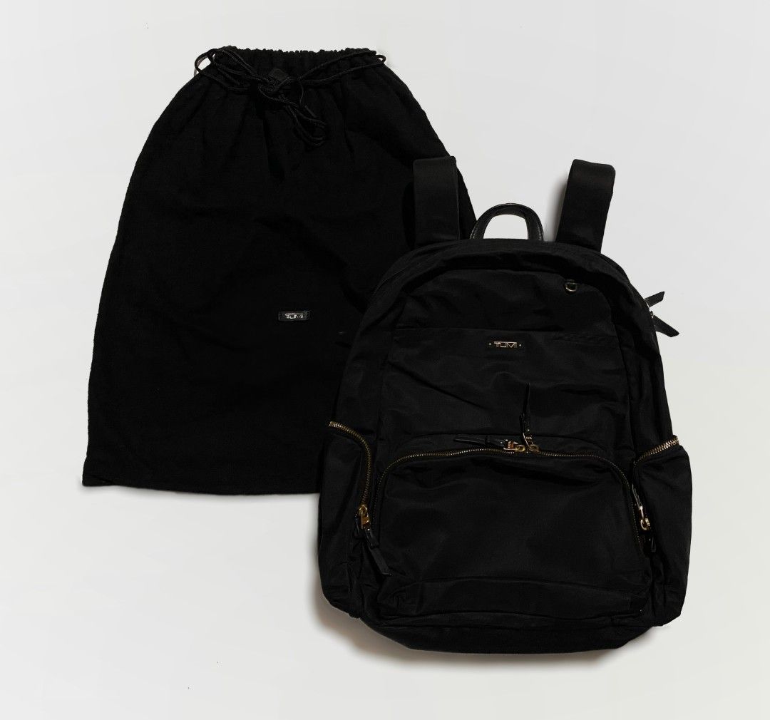 TUMI Nylon Backpack (Category: Backpacks) located in Bacolod City. Submitted by bt_ph (Listing ID 1323085308, Image 1). Description: Authentic TUMI nylon backpack 5 outer zipped compartment including with Laptop Compartment 4 inner compartments for main one, 1 zipped 3 inner compartments for front division Nylon material ykk zip Dimensions: 18 x 15 x 5 inches with free dust bag ***Thrifted.