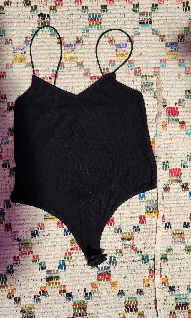Asos black spaghetti strap bodysuit (Category: Others Tops) located in Makati City. Submitted by beabbbea (Listing ID 1324796424, Image 1). Description: low back fits xs to s shipping via lalamove/grab or lbc.