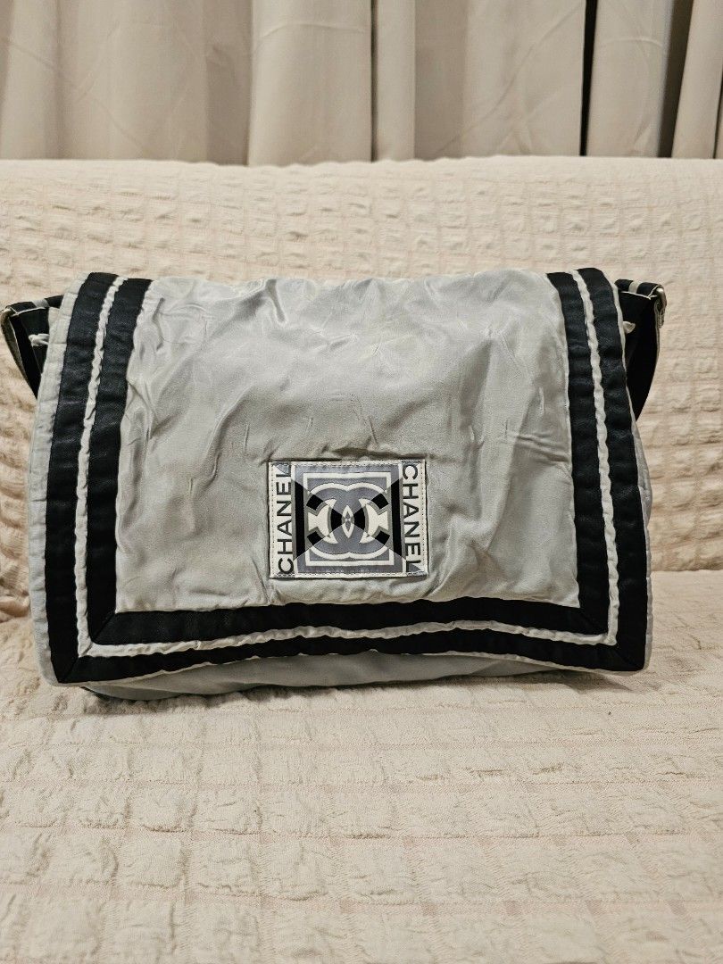 Authentic Chanel Nylon Messenger Bag (Category: Luxury Bags & Wallets) located in Paoay. Submitted by ysmattic (Listing ID 1324869066, Image 1). Description: 100% guaranteed authentic CC Sport Nylon Messenger bag. — Holo intact, series 10. — Will fit 13" laptop. — Needs deep cleaning, no flaws. — Unisex..