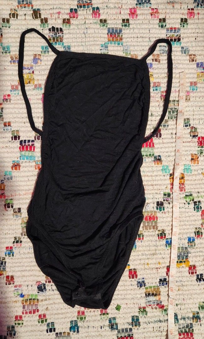 Boohoo black backless bodysuit (Category: Others Tops) located in Makati City. Submitted by beabbbea (Listing ID 1324798188, Image 1). Description: low back, soft jersey fabric. with complete snap buttons fits xs to s shipping via lalamove/grab or lbc.