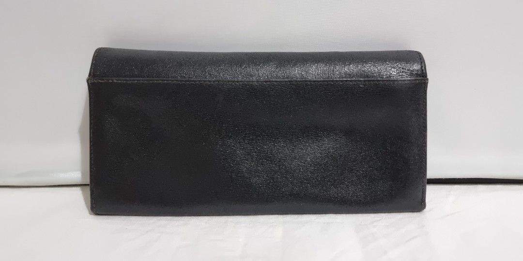 Givenchy Bifold Wallet (Category: Luxury Bags & Wallets) located in Binangonan. Submitted by c_r_i_s (Listing ID 1324877215, Image 2). Description: Givenchy Bifold Wallet Authentic Dimensions: Vintage With signs of use, scuffs, scratches, and creases With slight tear (2) on the card slot. Pls refer to the 9th picture Made in Spain.
