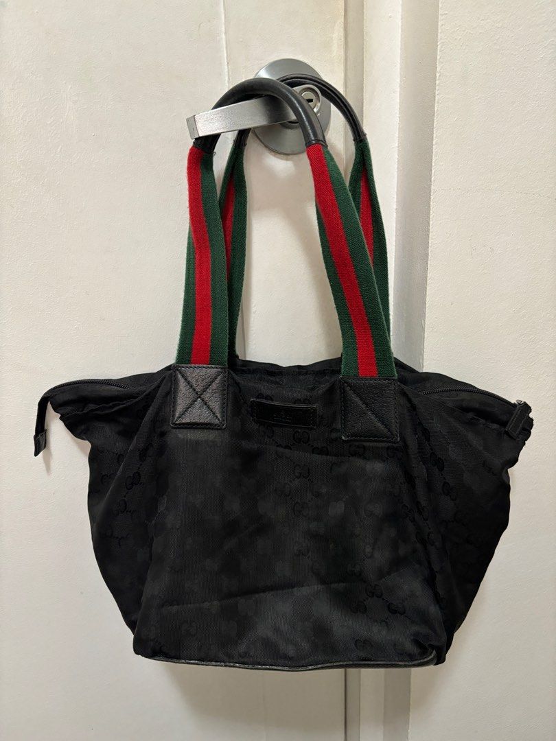 Gucci Cherry Line black hand bag (Category: Tote Bags) located in Marikina City. Submitted by chiya.s0821 (Listing ID 1324853791, Image 1). Description: Selling for only P6,000 but still in good condition. Purchased in Dec 2023 during live selling and only used once. Metro Manila buyers only. I can also do meet up in Megamall at lunch time every Wednesday and Friday..